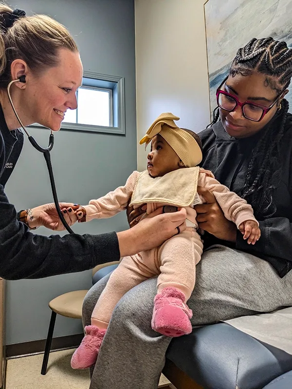 Nurse with a Mother and her Infant